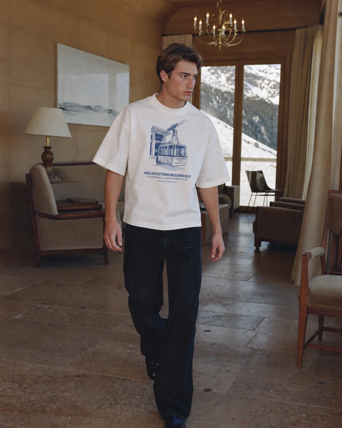 Man wearing the Télécabine Tee in white, on location