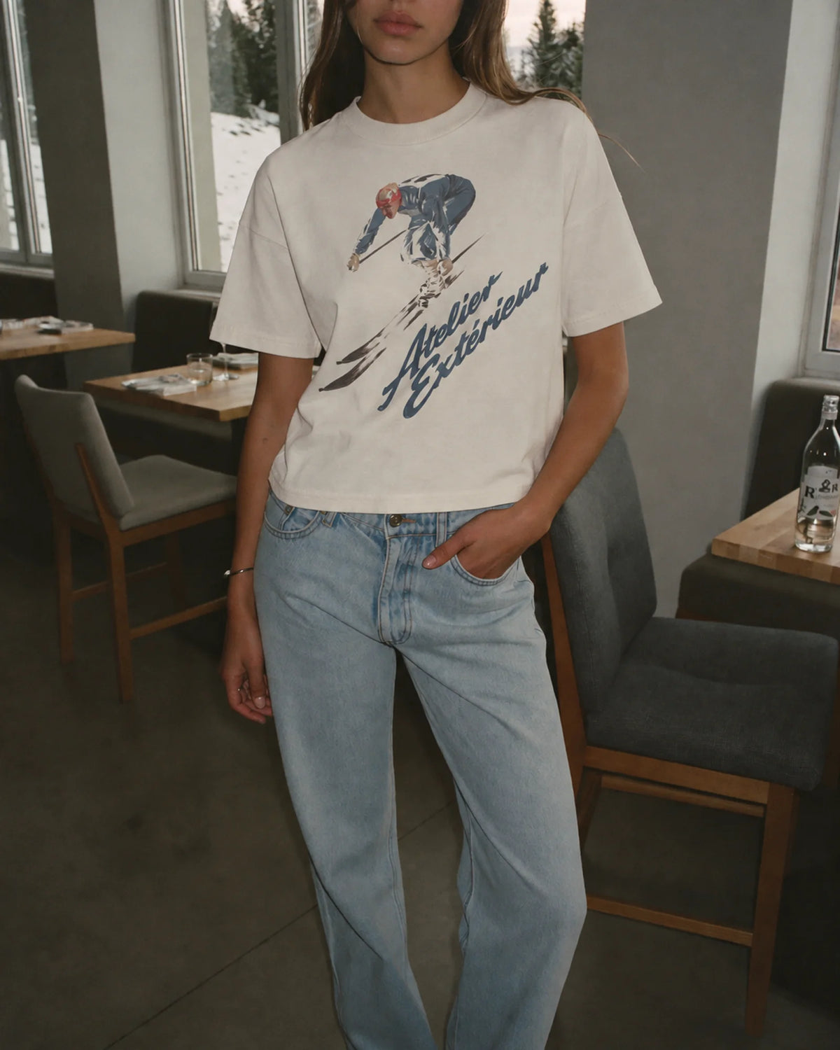 Woman wearing the Vintage Racing Tee, on location