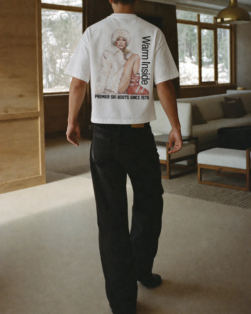 Man wearing the Warm Inside Tee in white, on location