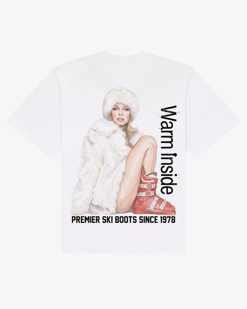 Warm Inside tee in white, flat lay back view with hand-painted ski boot graphic