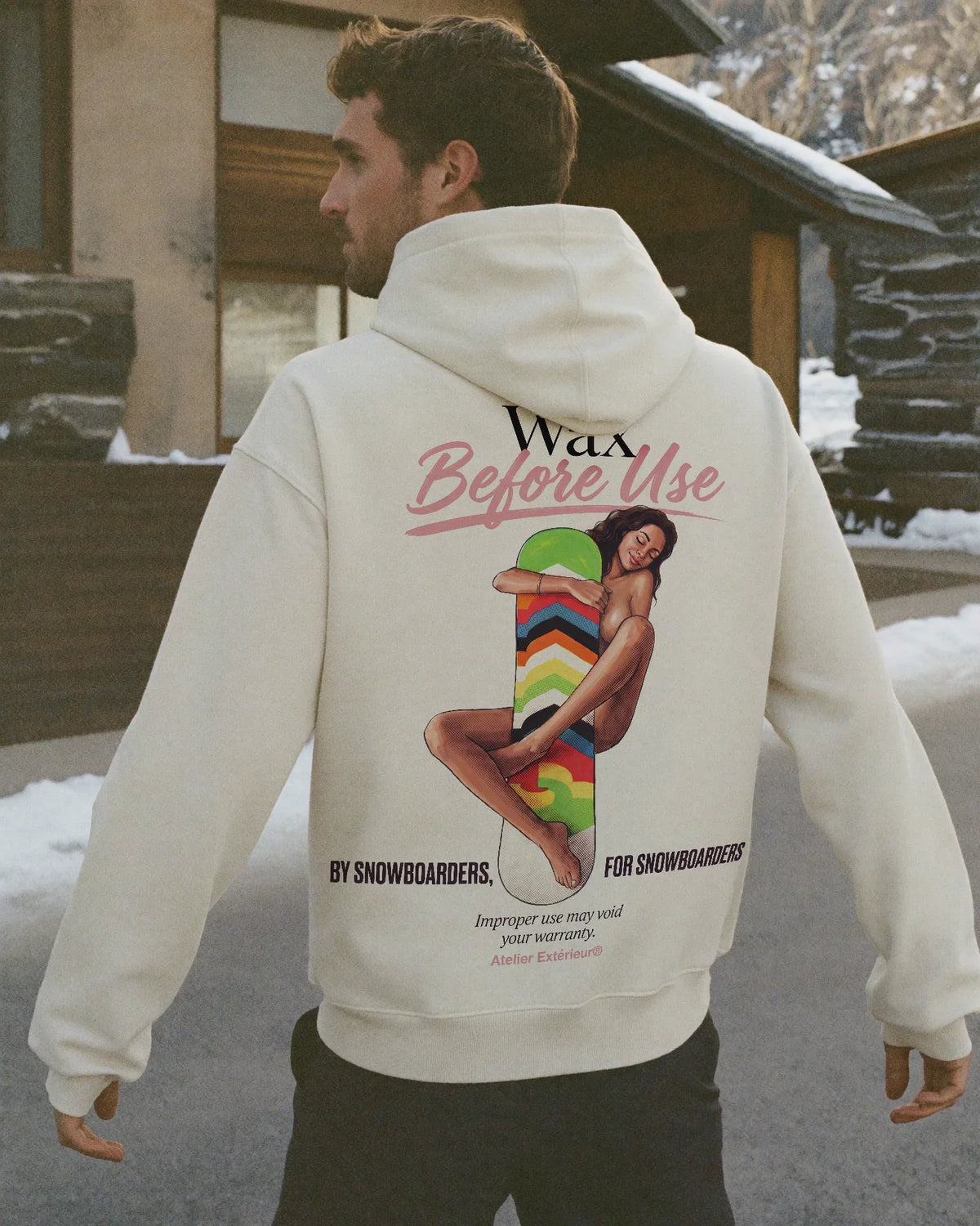 Man wearing the Wax Before Use Hoodie, on location