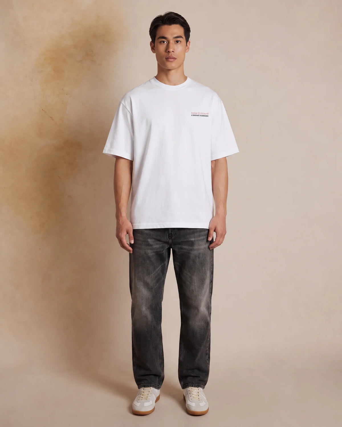 Studio model wearing the white Wax Before Use tee, front view
